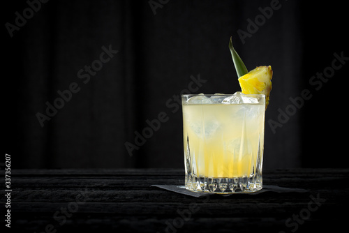 vintage style whisky sour, orange cocktail on the black background