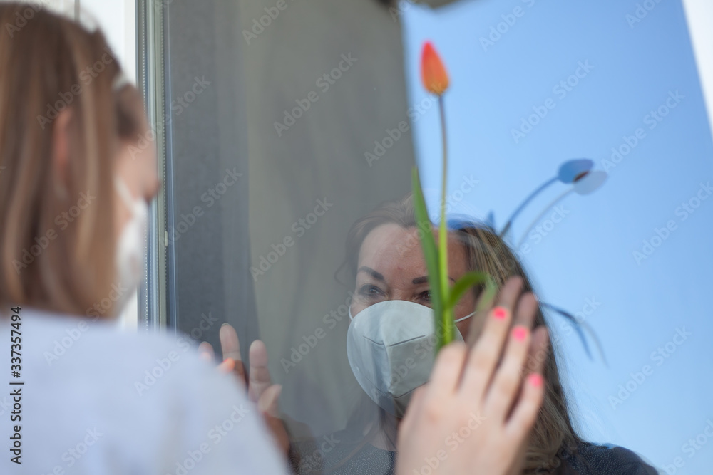 Covid 19. The woman came to visit her old parents who are quarantined.
