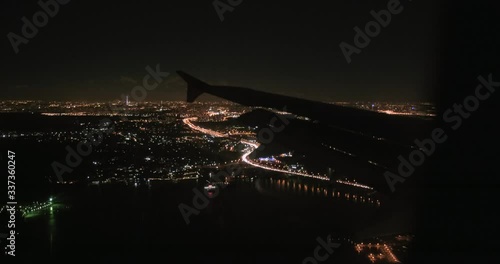 Airplane Landing in Moscow Sheremetyevo Airport at Night flying over Most Cherez Vodokhranilishche photo