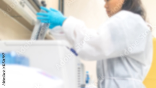 Novel coronavirus COVID-19 concept. Blur background professional doctor or lab technician working in laboratory testing blood sample in hospital  medical and healthcare.