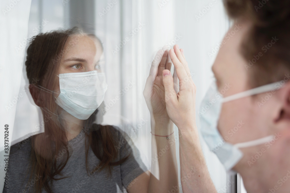 Quarantine. Coulpe Touching Each Other Through Glass. Lockdown Concept, CoVid-19. Quarantine. Coulpe Touching Each Other Through Glass. Lockdown Concept, CoVid-19.