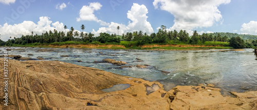 Beautiful panoramic nature in Sabaragamuwa, Sri Lanka with a river and forest in the background