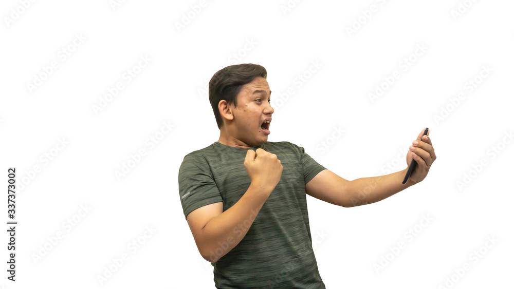 Wow and happy face expression of young Asian Malay man of what he see in the smartphone. Wow and happy face expression of young Asian Malay man of what he see in the smartphone.