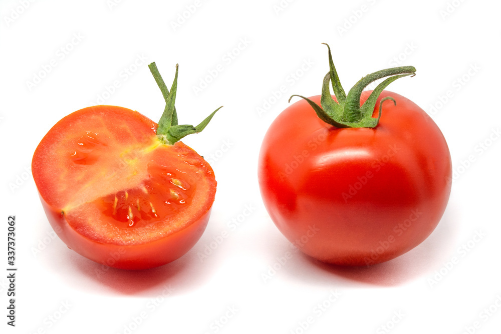 whole and cut tomatos isolate on white background whole and cut tomatos isolate on white background