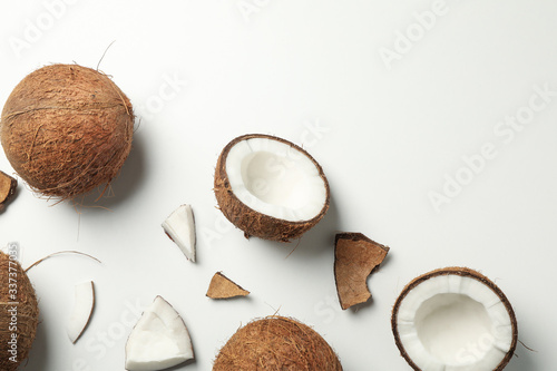 Flat lay with coconut on white background, top view