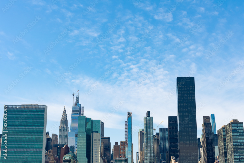 Modern Skyscrapers in the Midtown Manhattan Skyline of New York City with a Beautiful Blue Sky