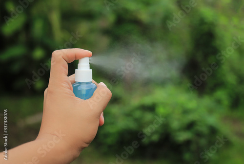 hand using alcohol gel spray for prevent bacteria 