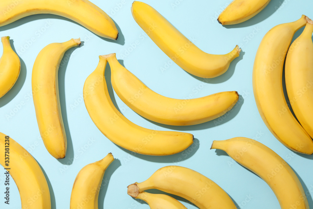 Banana clusters on blue background. Fresh fruit Banana clusters on blue background. Fresh fruit