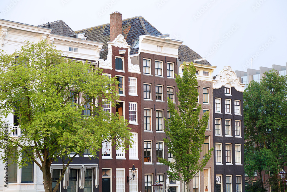 Naklejka premium Old traditional buildings in Amsterdam, Netherlands