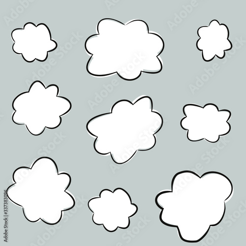 Set of cartoon hand-drawn clouds. White clouds with a black stroke. Vector illustration of speech bubble for banners, posters and web design.