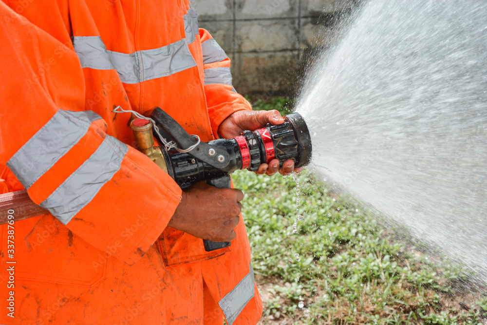 Fototapeta premium Firefighters Extinguishing House Fire