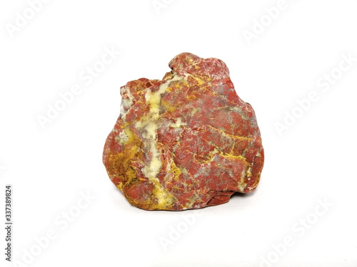 Jasper stone and quartz veins  on white background. red stone  Jasper stone is an aggregate mineral commonly used in New Age practices and in feng shui.