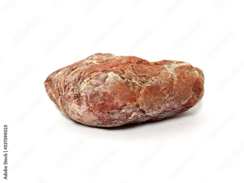 Jasper rock on white background. red stone, Jasper stone is an aggregate mineral commonly used in New Age practices and in feng shui. Jasper rock on white background. red stone, Jasper stone is an aggregate mineral commonly used in New Age practices and in feng shui.
