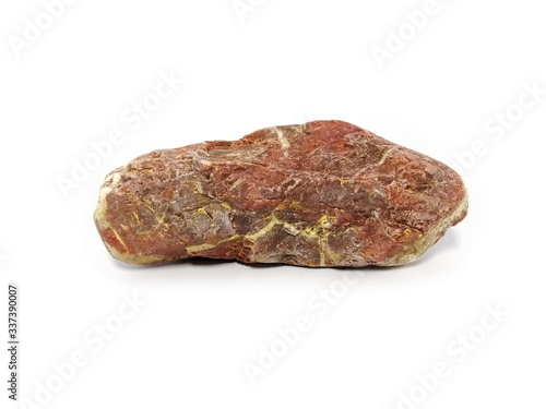 Jasper rock on white background. red stone, Jasper stone is an aggregate mineral commonly used in New Age practices and in feng shui.