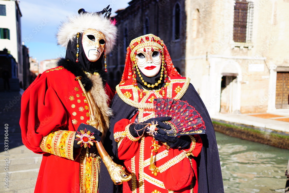 VENICE / ITALY - February 6 2016: Carnival performers participate this event in Piazza San Marco in Venice, Italy. The tradition began in 1162 to celebrate the defeated Ulrico, Patriarch of Aquileia