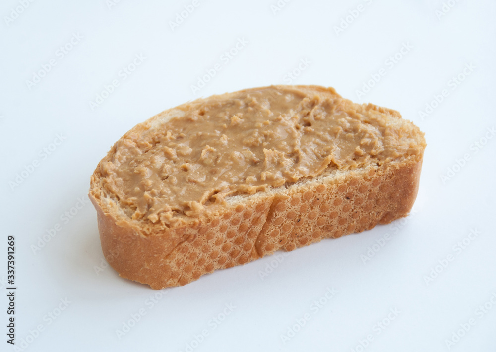 Peanut butter on toast slice, isolated on white background Peanut butter on toast slice, isolated on white background