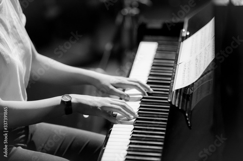 Young pianist playing in orchestra