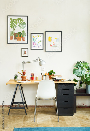 Artist s workplace for working from home with watercolor paints  brushes and sketchbooks. Place for design  illustration and creativity.