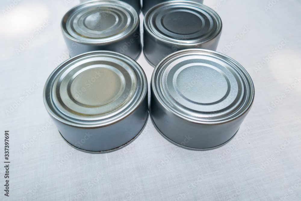 Stocking Up - A row of shiny canned food. Stocking Up - A row of shiny canned food.