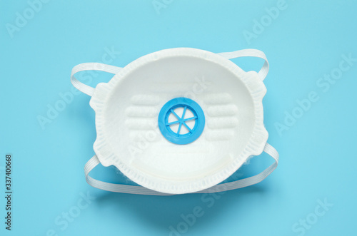 White medical mask isolated. Face mask protection flu and coronavirus. Health care and surgical concept. Top view. - Image