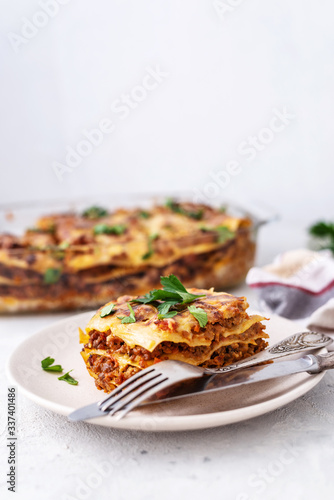 Delicious homemade italian Lasagna with bachamel sauce on gray background. Hot tasty Lasagna with cheese