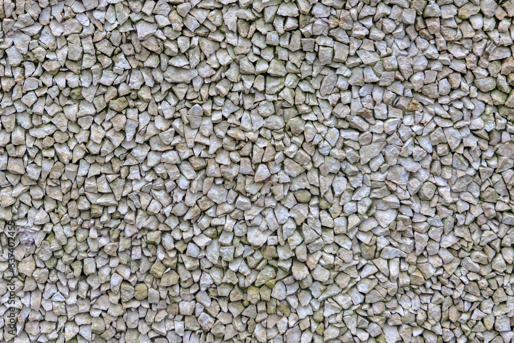 The texture of the stone pavement. Background of gravel The texture of the stone pavement. Background of gravel