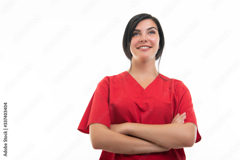 Low angle of young female nurse standing with arms crossed Low angle of young female nurse standing with arms crossed