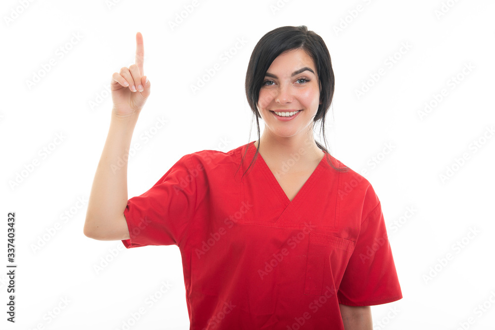 Portrait of young attractive female nurse making good idea gesture Portrait of young attractive female nurse making good idea gesture