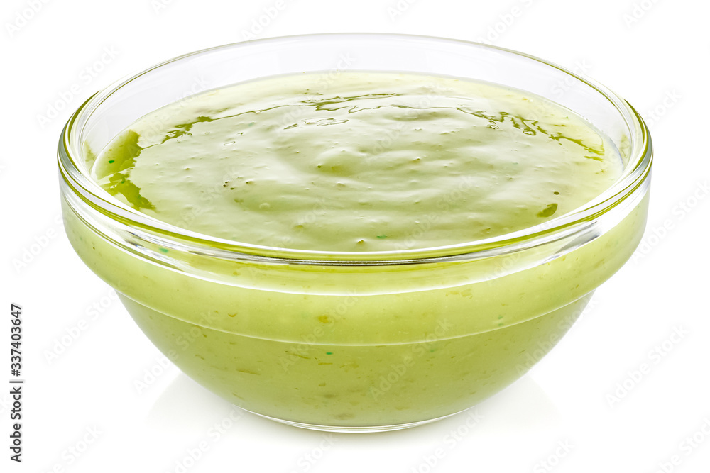 Green chili sauce with lime in a small transparent glass round bowl isolated on white background Green chili sauce with lime in a small transparent glass round bowl isolated on white background
