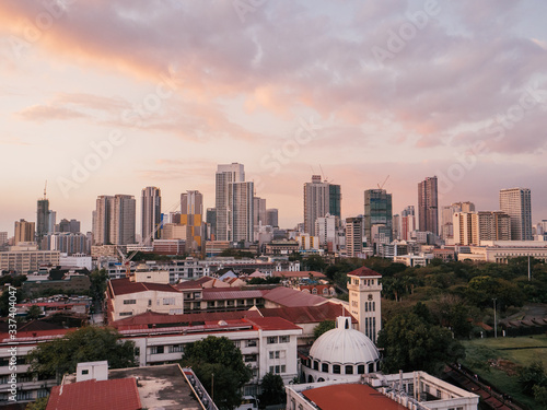 Skyline of Binondo District in Metro Manila while sunset © SmallWorldProduction