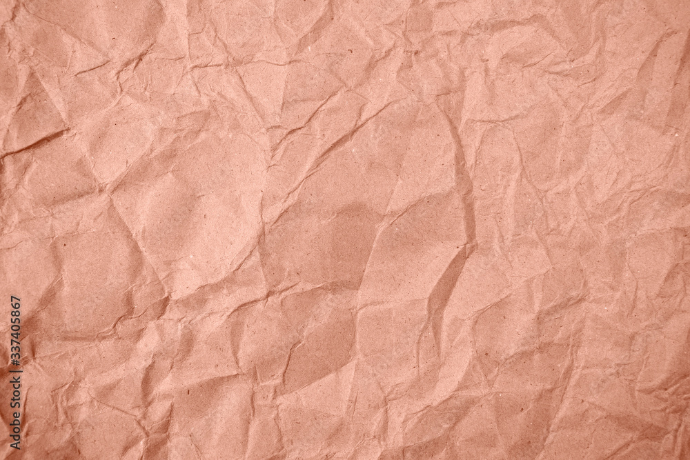 Fototapeta premium Crumpled brown paper in the background