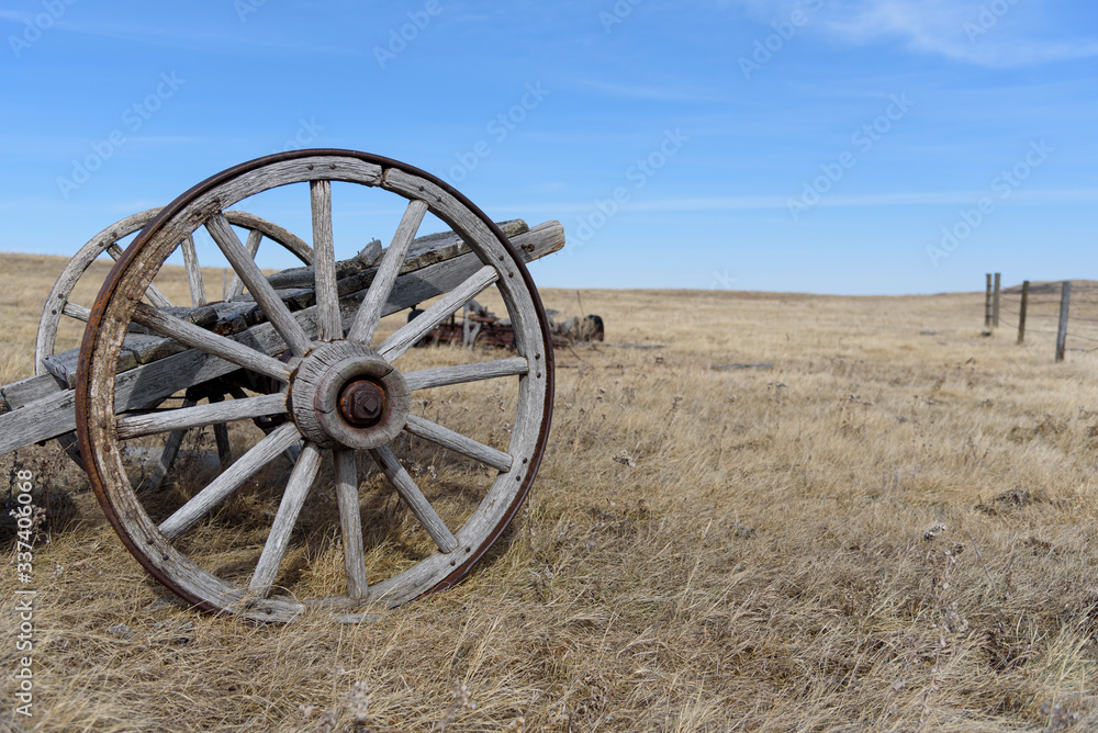 old wooden wheeled wagon on the prairies