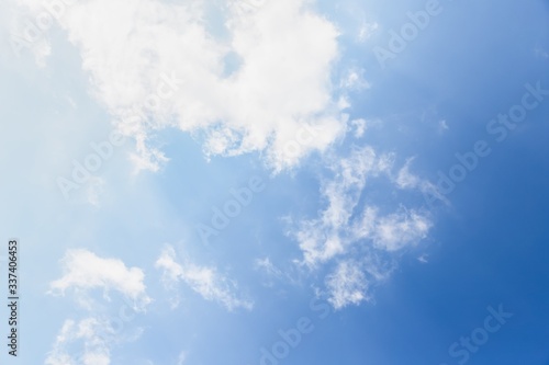 Light transparent white light clouds on a blue background