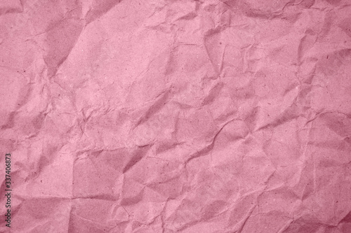 Crumpled pink paper in the background
