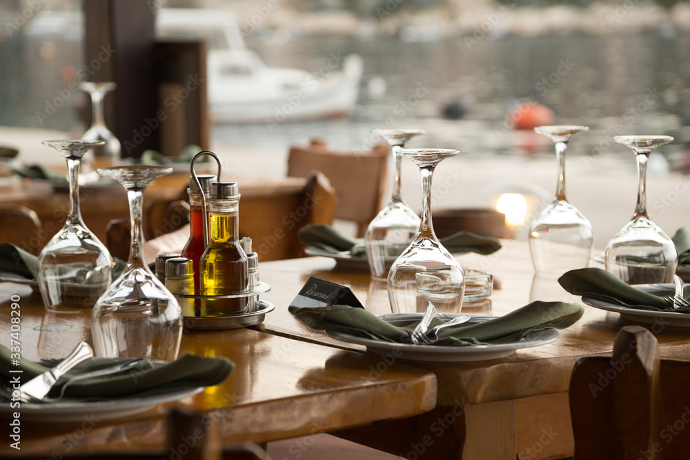 Table in konoba, on island, bay, next to anchorage, Croatia. Table in konoba, on island, bay, next to anchorage, Croatia.
