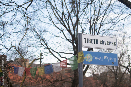 Street sign of Tibet square in Vilnius.  Standard tibetan and lituanian. photo