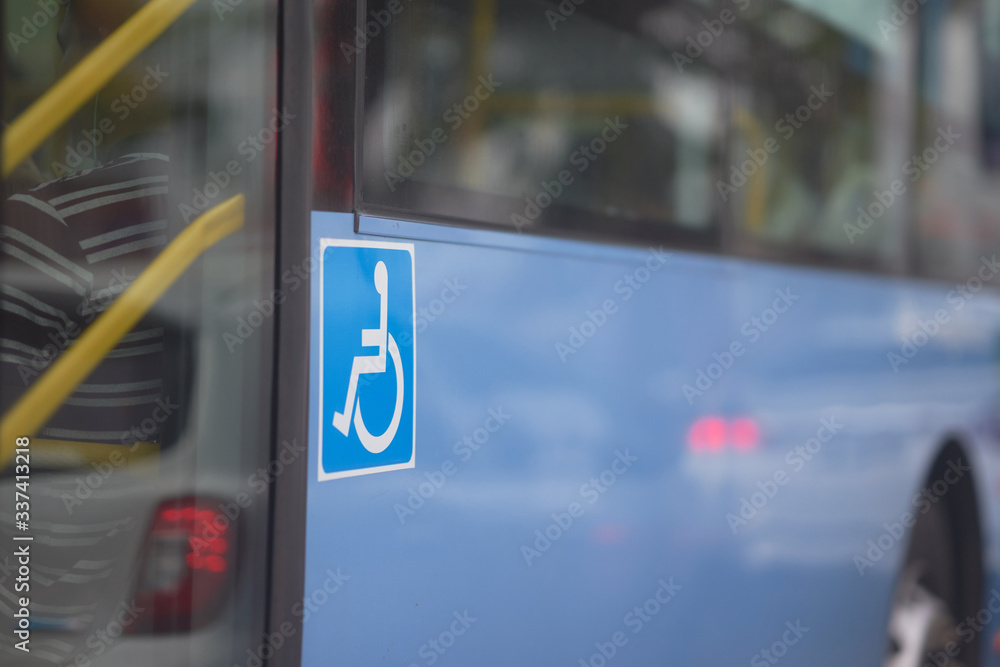 handicap sign on side of bus near door handicap sign on side of bus near door