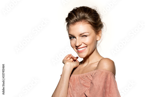 Obraz na plátne Happy beautiful woman smiling and winking.