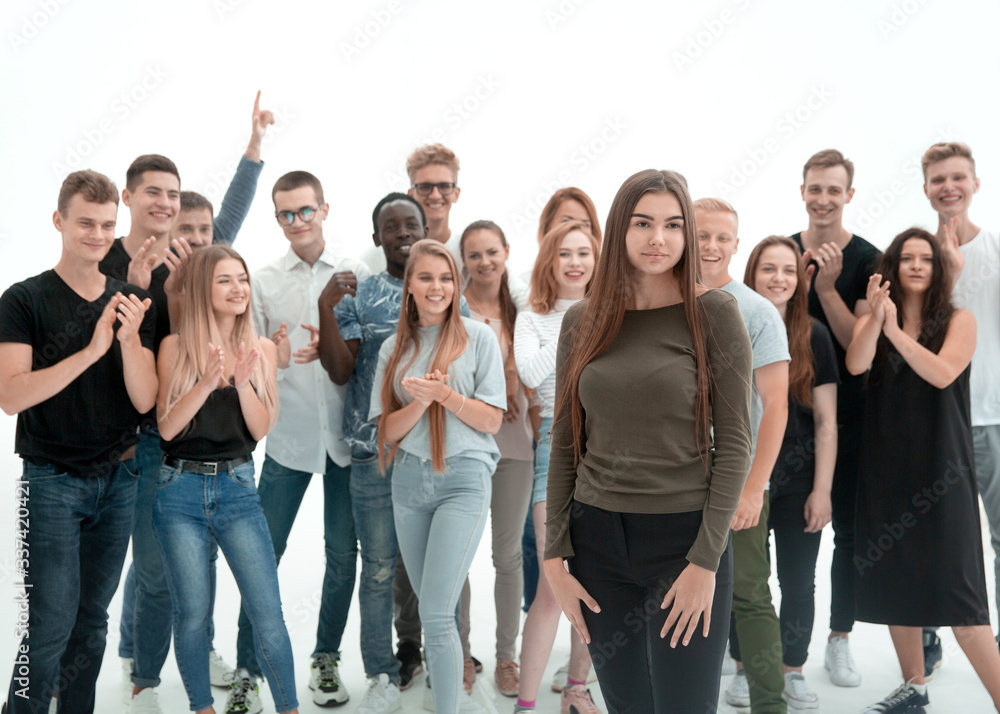 young woman standing in front of her friends team