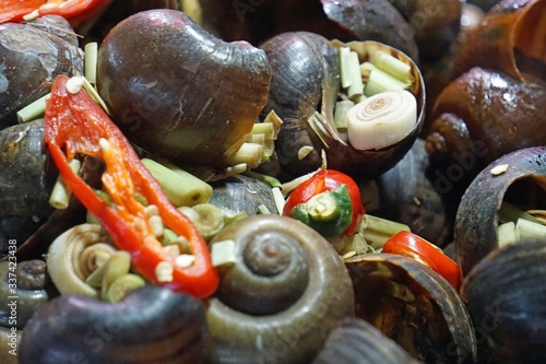 mussels on a night market in da nang in vietnam photo