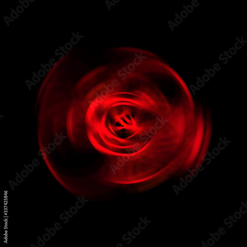 Fototapeta Naklejka Na Ścianę i Meble -  Spinning rays of light isolated on black background. Graphic 2D illustration of glowing colorful light particles in circular motion.