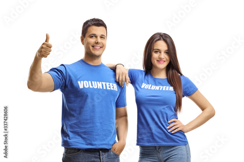Volunteers posing and showing thumbs up