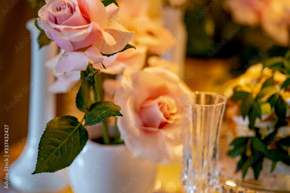 Fototapeta premium bouquet of orange roses in vase