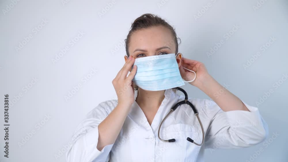 Close up of caucasian doctor with a stethoscope in protective mask Close up of caucasian doctor with a stethoscope in protective mask