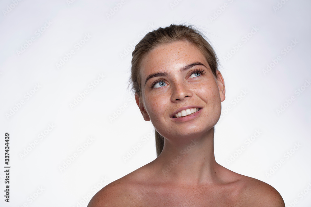 Beautiful girl with freckles and blue eyes Beautiful girl with freckles and blue eyes