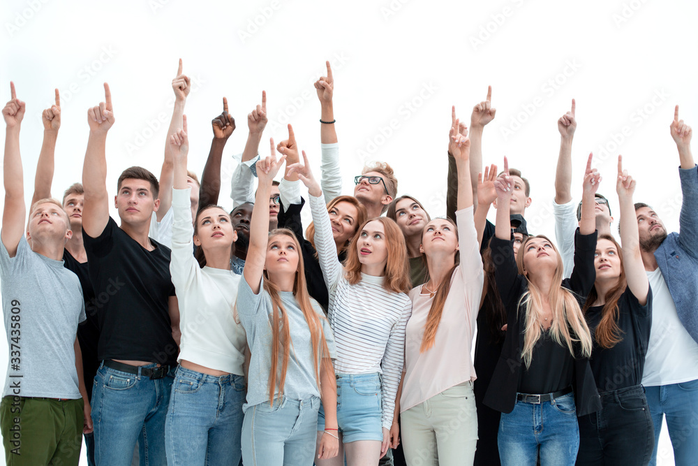 group of serious young people where pointing up group of serious young people where pointing up