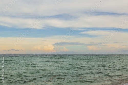 Gorgeous colorful view of turquoise water of Atlantic ocean and blue sky with white clouds. Miami Beach. Beautiful nature background. © Alex