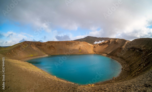 The mouth of a volcano crater filled with water in Iceland. Water Lake in the volcano caldera