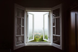 Wide open window with amazing countryside view on foggy day. Stay home concept. Scenery view from the house. Travel to Spain and holidays concept. Open a window to air the room. Ventilate your house.