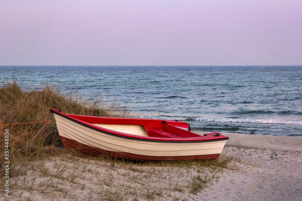 View of a small boat, on the beach of the Baltic Sea near Trelleborg, Sweden.